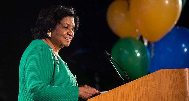 President Coley at a podium during the 2022 fall conference celebration.